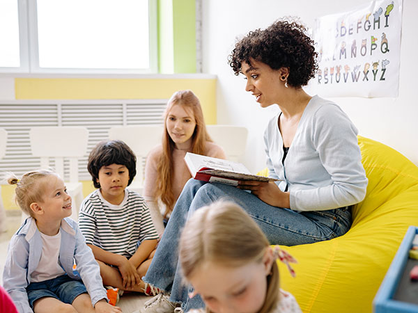 Banks Teacher Reading to Students